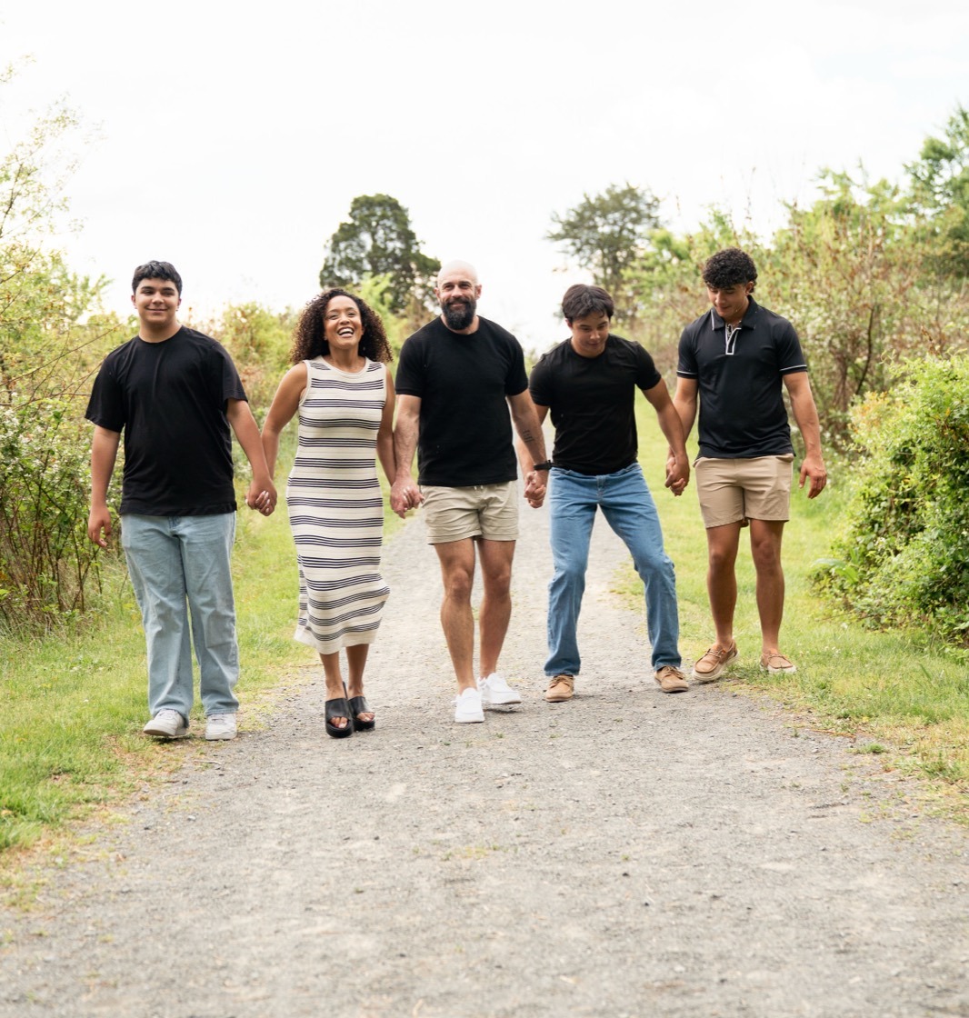 Erica, Joshua, and their three sons walking together